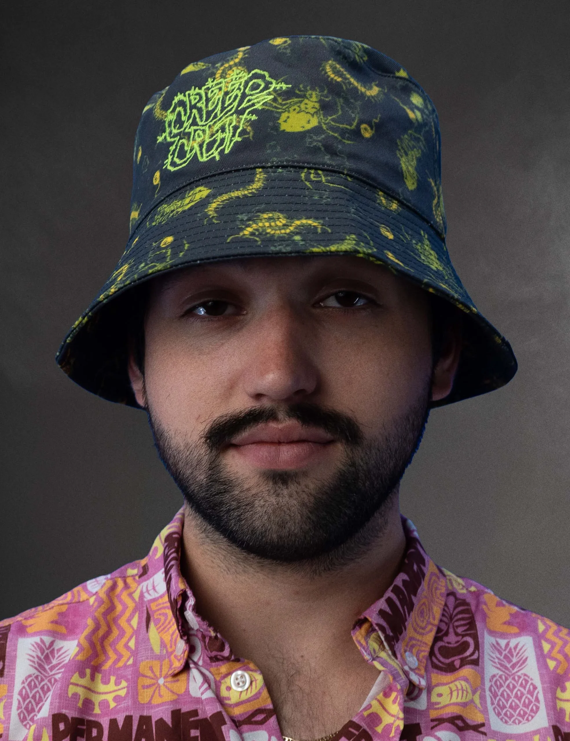 Rear perspective showing the clean back construction and hem of the Creepy Crawlies Green Bucket Hat - Creep Cast Merch