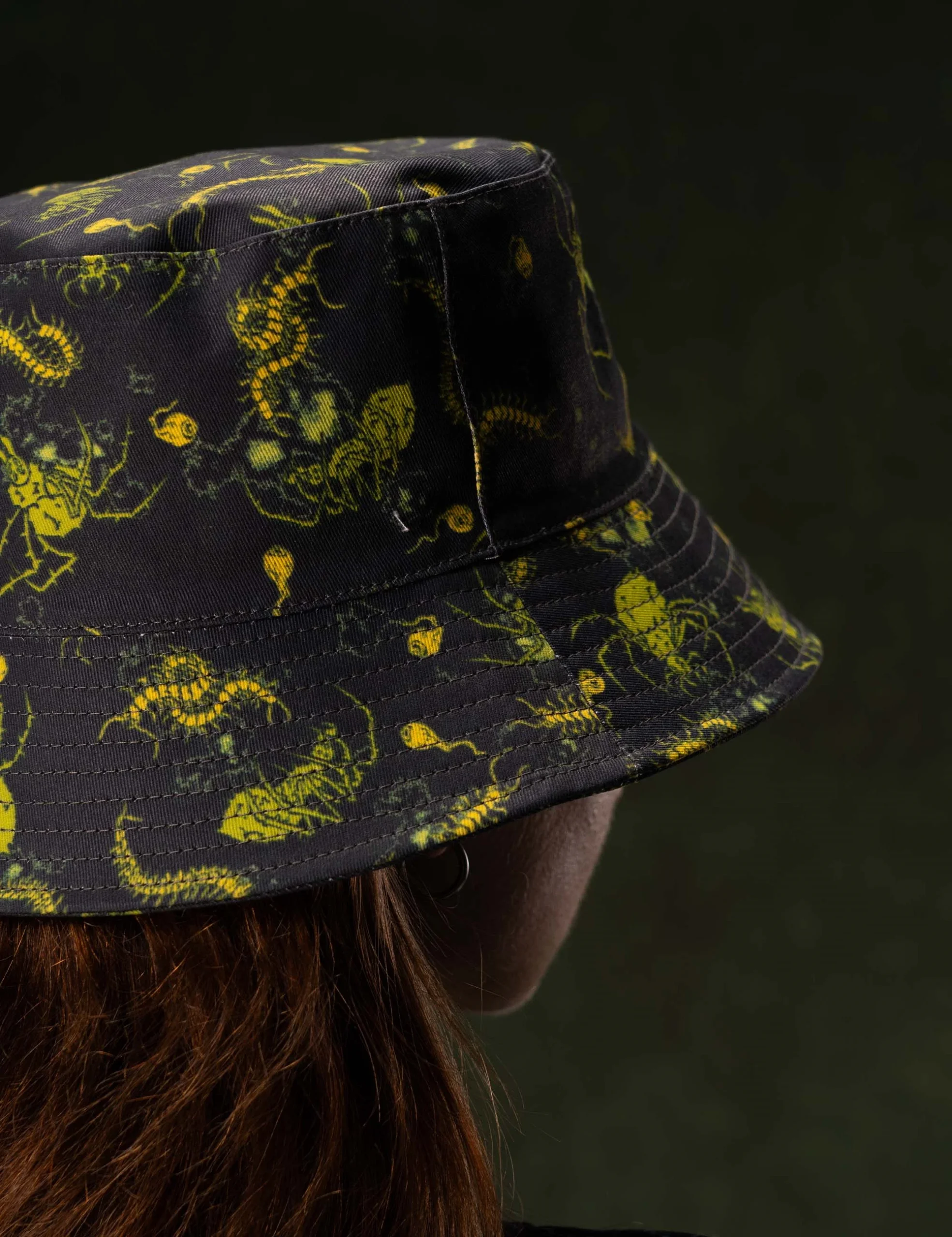 Detailed craftsmanship perspective 8 of the Creepy Crawlies Green Bucket Hat - Creep Cast Merch