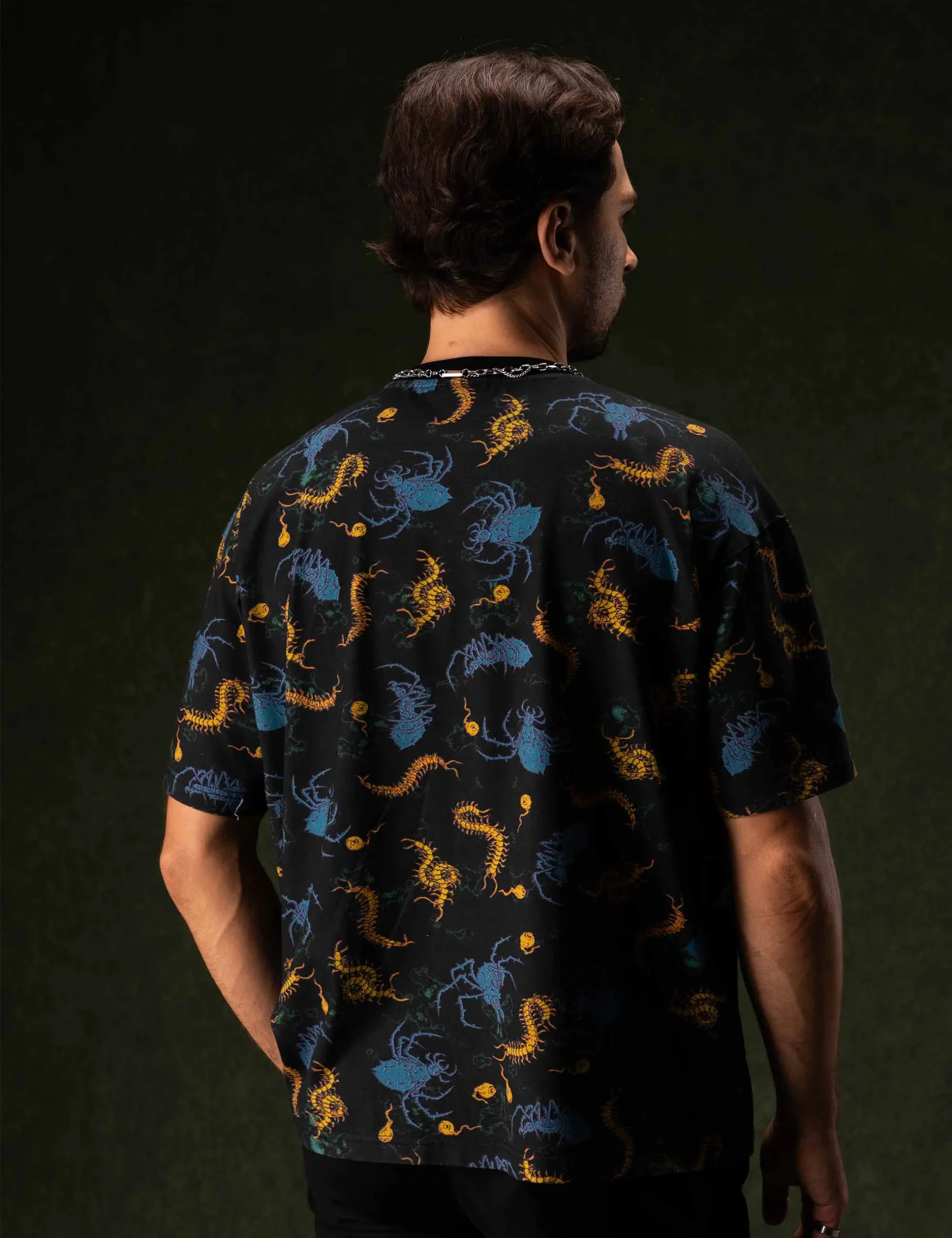 Close-up texture of the fabric weave and reinforced stitching on the Creepy Crawlies Oversized Tshirt - Creep Cast Merch