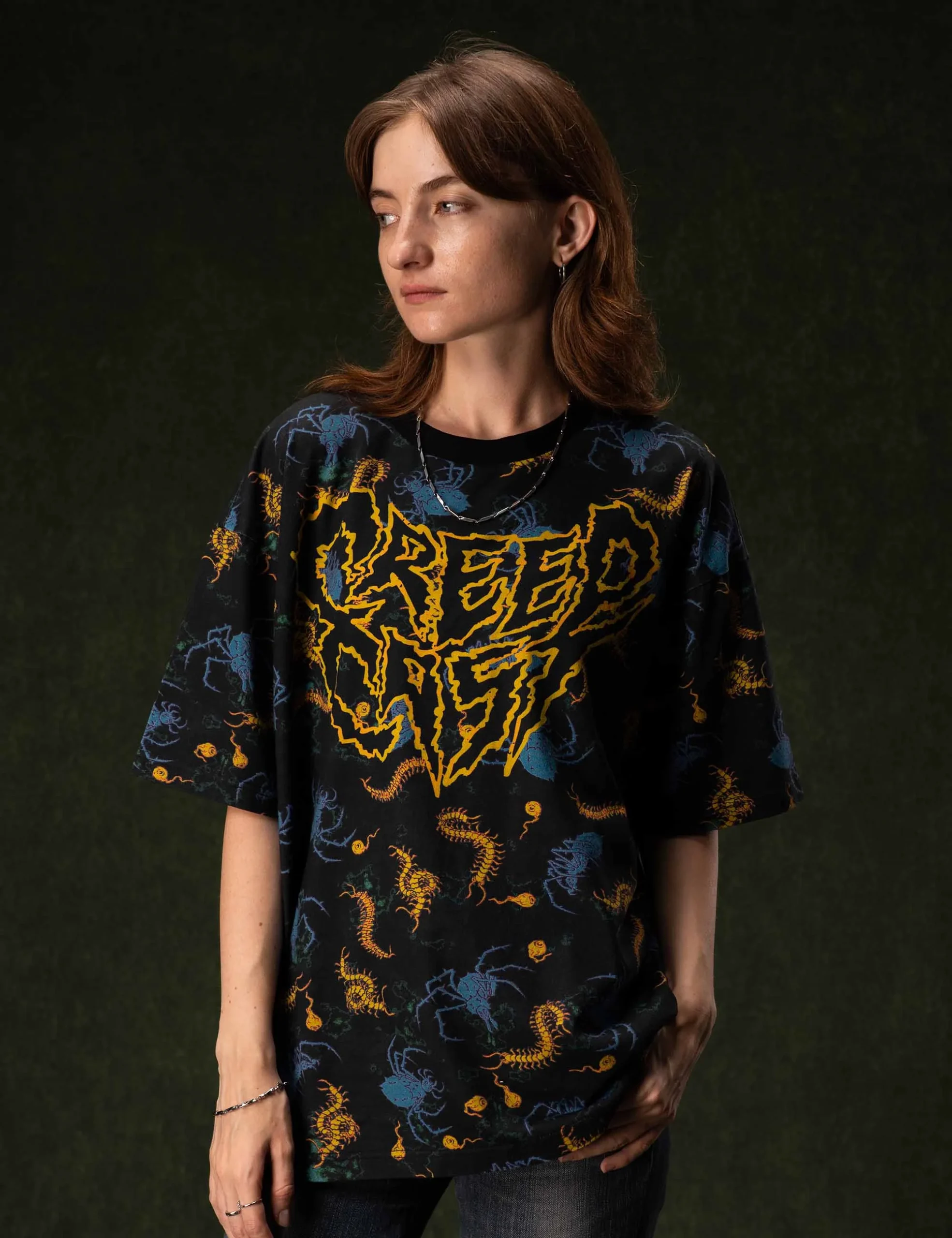 Lifestyle perspective displaying the relaxed unisex fit of the Creepy Crawlies Oversized Tshirt - Creep Cast Merch